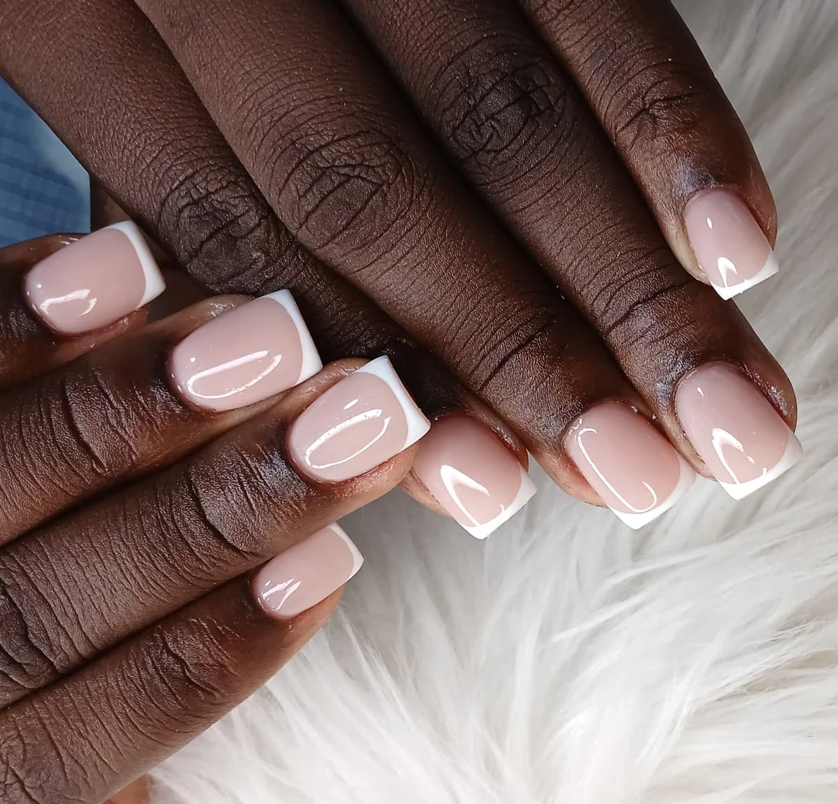 Poly Gel square nails with French tip at Glit Nails Osu Accra