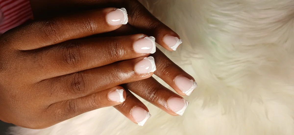 Gel X almond nails with rhinestone accents at Glit Nails Osu