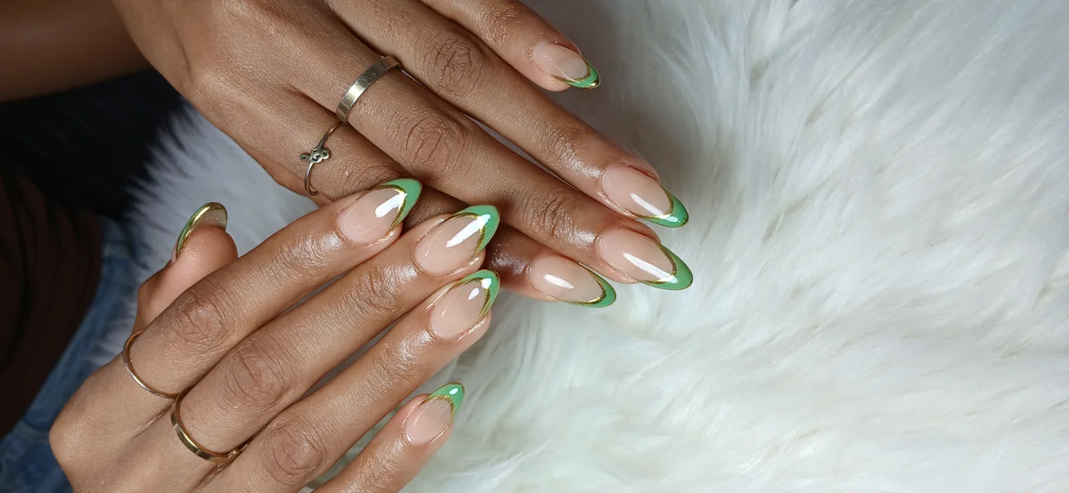 Manicure with floral nail art design at Glit Nails Osu Accra